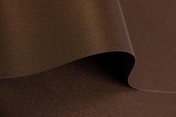 Poster - Rich brown paper background with a smooth, glossy texture and metallic bronze shimmer. Elegant waves and curves create a luxurious, abstract design with a warm gradient, perfect for premium designer.