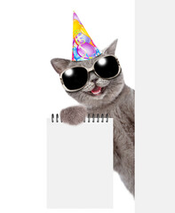 Poster - happy cat wearing party cap and sunglasses looks from behind blank white banner and shows blank note