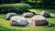© NashEmpire - Natural Garden Stones Surrounded by Green Grass and Plants