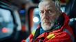 © Ari - Portrait of a Serious Senior Paramedic in an Emergency Vehicle
