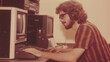 © Artem - Vintage 1970s programmer working with early computer technology