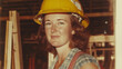 © Artem - 1970s female construction worker portrait in hard hat and work attire
