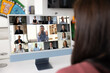 © fizkes - Female employee using computer screen for video conference chat with diverse colleagues, watching webinar, listening to team leader, boss, project manager speaking from monitor