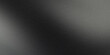 © Muaz - A gradient of gray and black with a grainy texture creating a dark and shadowy background effect