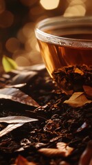 Aufkleber - A cup of tea sits atop a pile of leaves, offering a cozy and relaxing scene