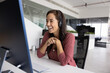 © fizkes - Cheerful online teacher woman in wireless headphones speaking at monitor, giving online training, talking to audience on video conference chat, smiling. Happy support manager laughing at workplace