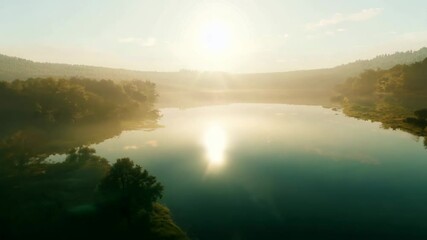 Fototapete - A body of water with a sun reflecting on it. The water is green and the sky is blue