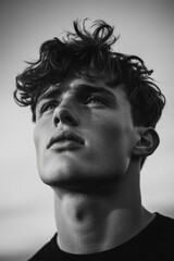 Aufkleber - A black and white portrait of a person with curly hair, suitable for use in editorial or creative contexts