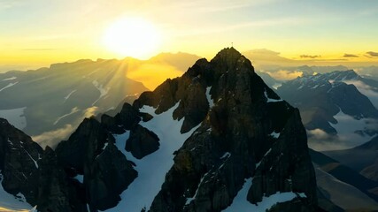 Poster - A majestic mountain peak with a snow-covered summit, basking in the warm glow of the sun. The sun's rays are casting a beautiful golden light on the mountain, creating a breathtaking scene