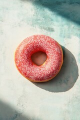 Poster - A single pink donut placed on a table