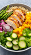 © bcendet - Grilled chicken and quinoa bowl with assorted vegetables