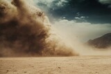 Powerful sandstorm engulfs a barren landscape.  A massive dust cloud billows upward,  powerful gusts of wind whipping across the dry desert.  Dramatic sky with dark clouds above