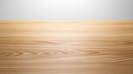 Poster - A smooth wooden surface illuminated by soft lighting, showcasing its natural grain and texture against a light backdrop.