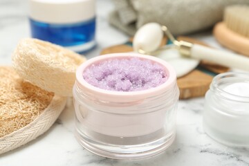Wall Mural - different body care products on white marble table, closeup