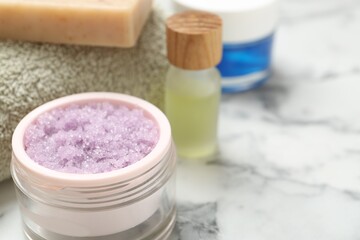 Wall Mural - different body care products on white marble table, closeup. space for text