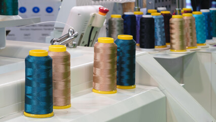 Poster - Industrial machine for embroidery of multi-colored threads on fabric