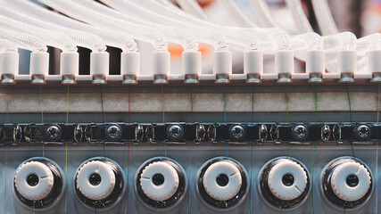 Poster - Industrial machine for embroidery of multi-colored threads on fabric