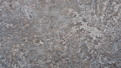 Leinwandbilder - Gray stone wall with rough texture as a background for a template or banner. The wall is made of stone and has a gray color