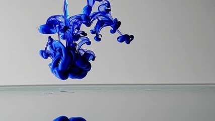 Poster - Blue ink swirling in clear water against white background. Abstract art concept