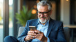 © Jutha - Happy middle aged business man using mobile phone sitting outside office stylish older busy businessman investor wearing glasses holding smartphone looking at cellphone doing financial payments. conce