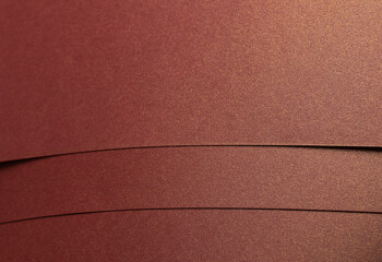 Poster - Rich burgundy paper texture with a pearlescent shimmer and glossy finish. Elegant and metallic reflective surface, perfect for luxury design and premium decorative backgrounds..