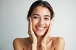 © miss irine - Smiling young Indian woman touches face, cares for facial skin. Skincare beauty treatment concept. Clean fresh face closeup studio shot. Attractive brunette lady model has healthy lifestyle.
