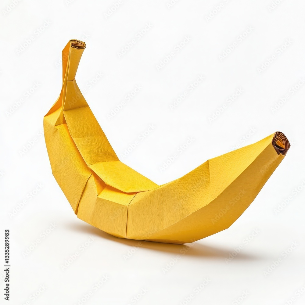 A yellow origami banana is displayed against a white background, highlighting the detailed folds and curves. The craftsmanship captures the essence of a banana, emphasizing artistic creativity.