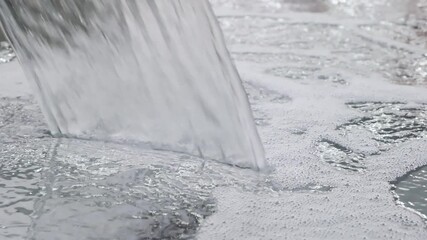 Poster - Stream of water is flowing into a body of water. The water is white and he is coming from a faucet