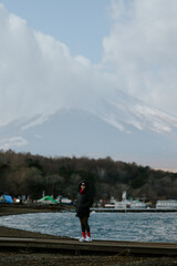 Wall Mural - happy tourist traveler woman enjoying with mount fuji in japan, spring and summer, japan travel vaca