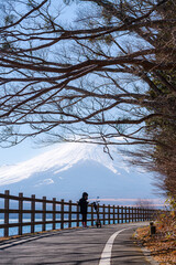 Wall Mural - happy tourist traveler woman enjoying with mount fuji in japan, spring and summer, japan travel vaca