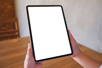Wall Mural - mockup image of a woman holding digital tablet with blank desktop screen