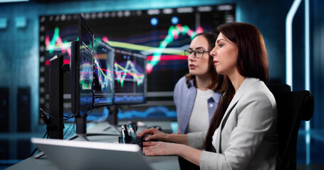 Poster - Financial analyst studying stocks on computer screen in busy office