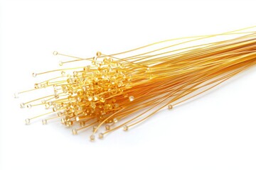 Poster - Golden glass bead stems resting on a white surface in a studio setup elegant craft supplies