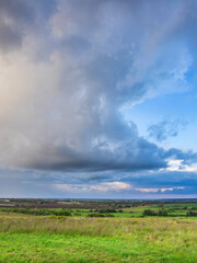 Wall Mural - a cloudy sky with a few clouds in the distance