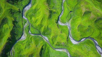 Aufkleber - Aerial view shows winding rivers through verdant green meadows