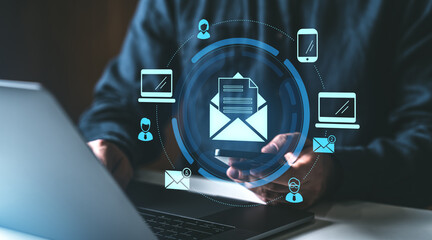 Poster - digital email communication concept with holographic icons floating above a laptop and smartphone in