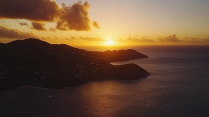 Poster - A beautiful scenic view of mountains and the ocean at sunset