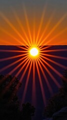 Poster - Vibrant sunset radiating sunbeams above distant mountainous landscape