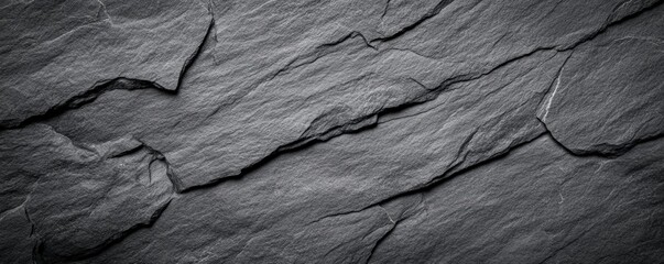 Poster - A textured slate surface showcasing dark, rough patterns and natural cracks, offering a rustic appearance.