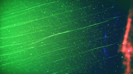 Poster - A vibrant, abstract image featuring swirling green and red colors with fine lines and specks, creating a dynamic, energetic visual effect.