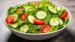 © zetta cuevas  - Fresh Green Salad with Crisp Lettuce, Cherry Tomatoes, and Sliced Cucumbers in a White Bowl on a Textured Background for Healthy Eating Concepts