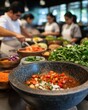 © Sergio Lucci - Culinary training in a modern kitchen classroom with professional chefs preparing dishes