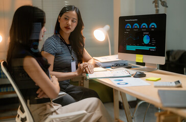 Poster - Asian businesswomen discussing marketing strategy using computer dashboard showing charts and graphs