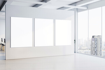 Poster - Modern office interior with three blank posters on a white wall. 3D Rendering