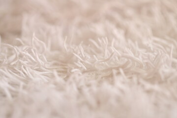 Aufkleber - A close-up shot of a soft and fluffy white blanket, ideal for use in interior design or fashion photography.