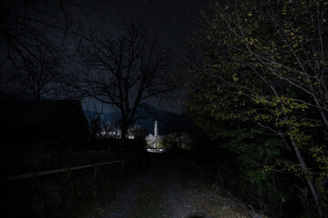 Wall Mural - old house with a ghost in the forest at misty night or night scene with house under moon. old mystic