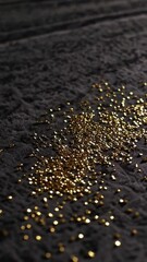 Poster - Glittering gold particles cascading on dark surface in slow motion