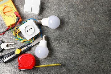 Poster - Different electrical tools on grey table, flat lay. Space for text