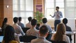 © VistaVisions - Male speaker giving presentation in hall at university education workshop. Audience or conference hall. Rear view of unrecognized participants in audience. Scientific conference event, training