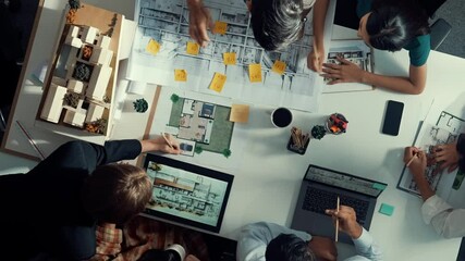 Poster - top aerial view business people brainstorming about building interior at table with house model and 